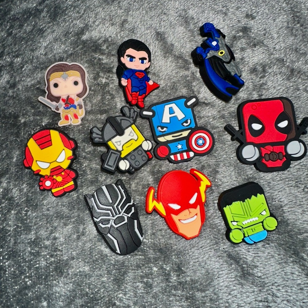 Ten pice set of random super hero croc charms NEW